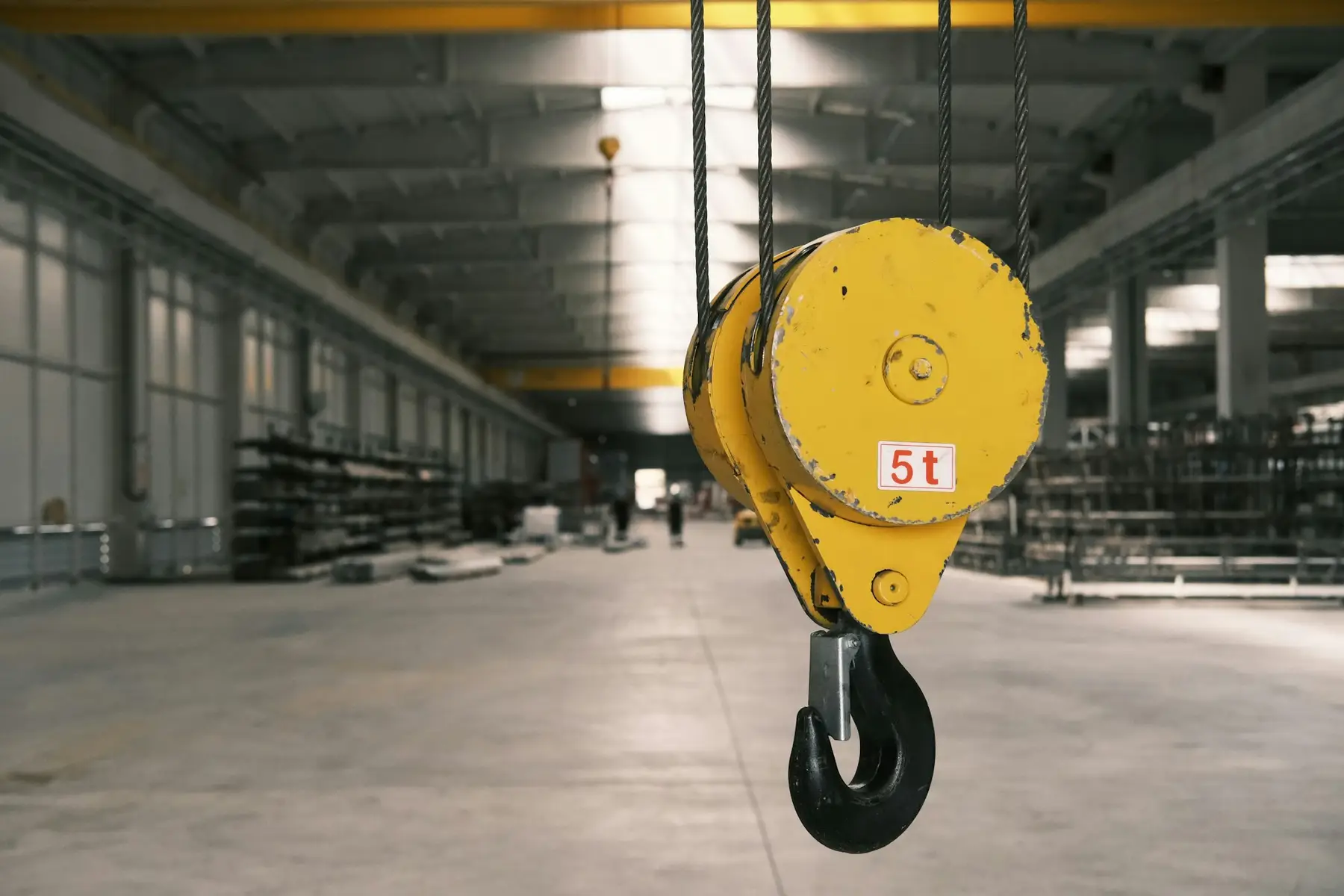 Overhead crane hook in an industrial building